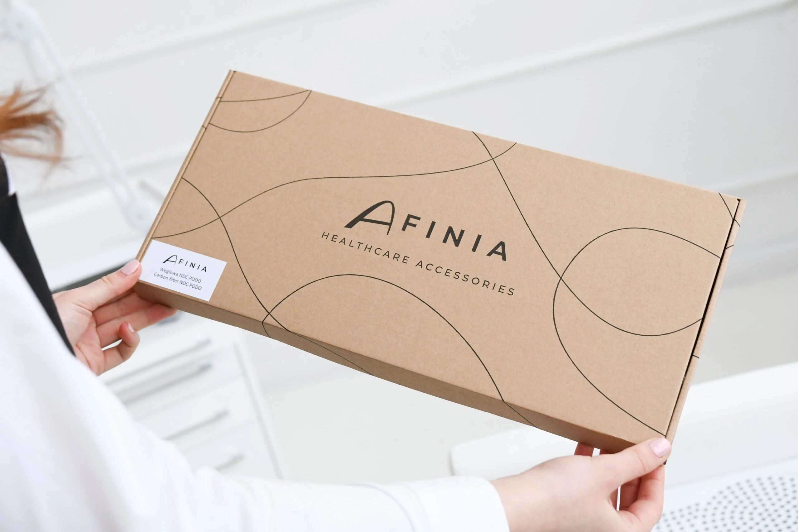 Verpackung von AFINIA Healthcare Accessories in einer ansprechenden Pappbox