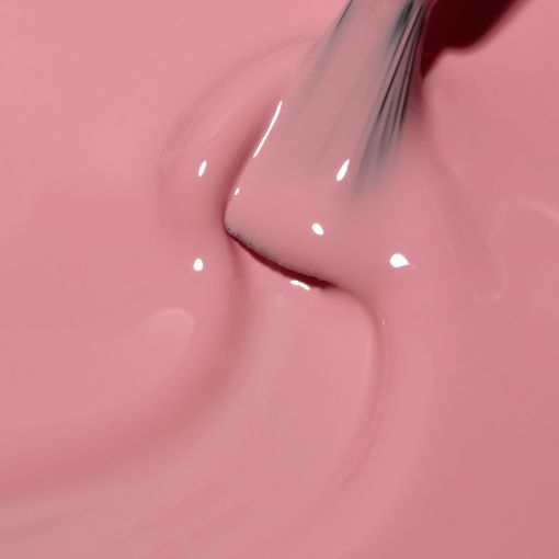 c8846_b Nahaufnahme einer zarten rosa Farbe, die mit einem Pinsel vermischt wird.
