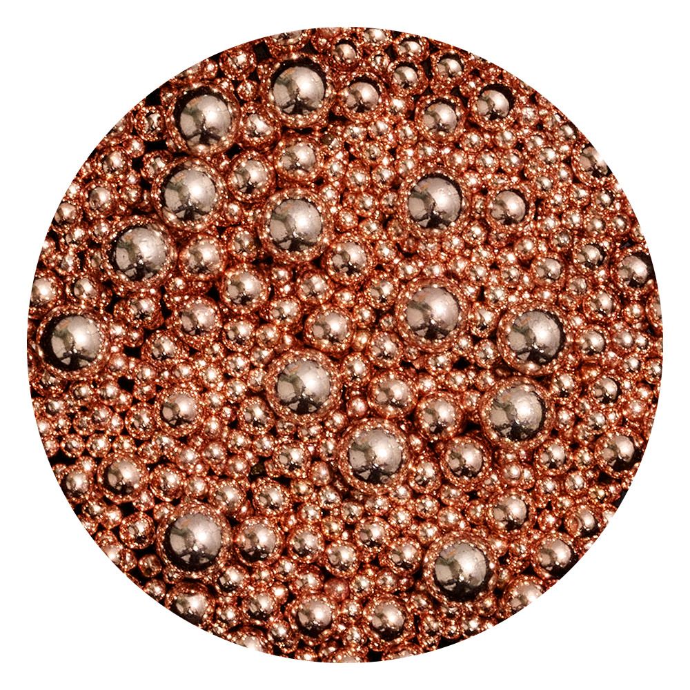 Detailaufnahme von roségoldenen Perlen in verschiedenen Größen