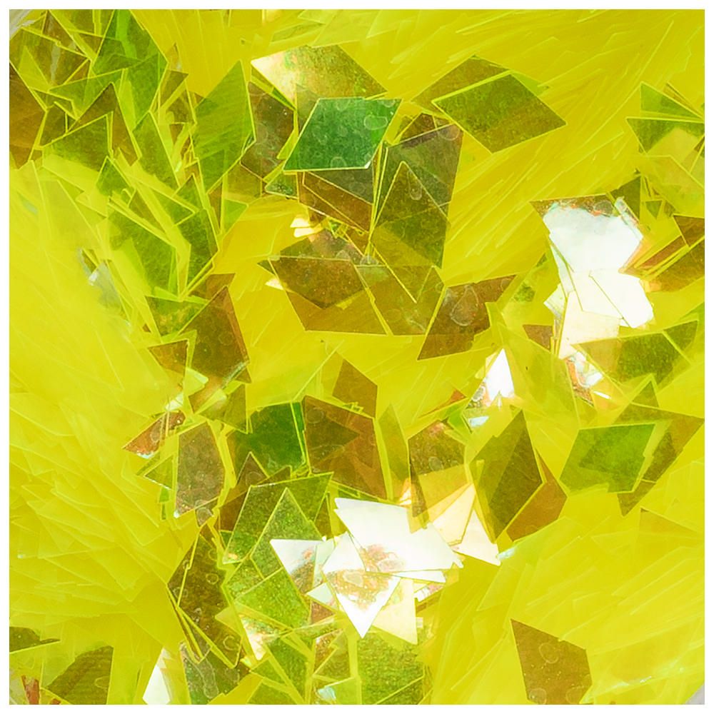 Nahaufnahme von glitzernden gelben und grünen Dekorationselementen