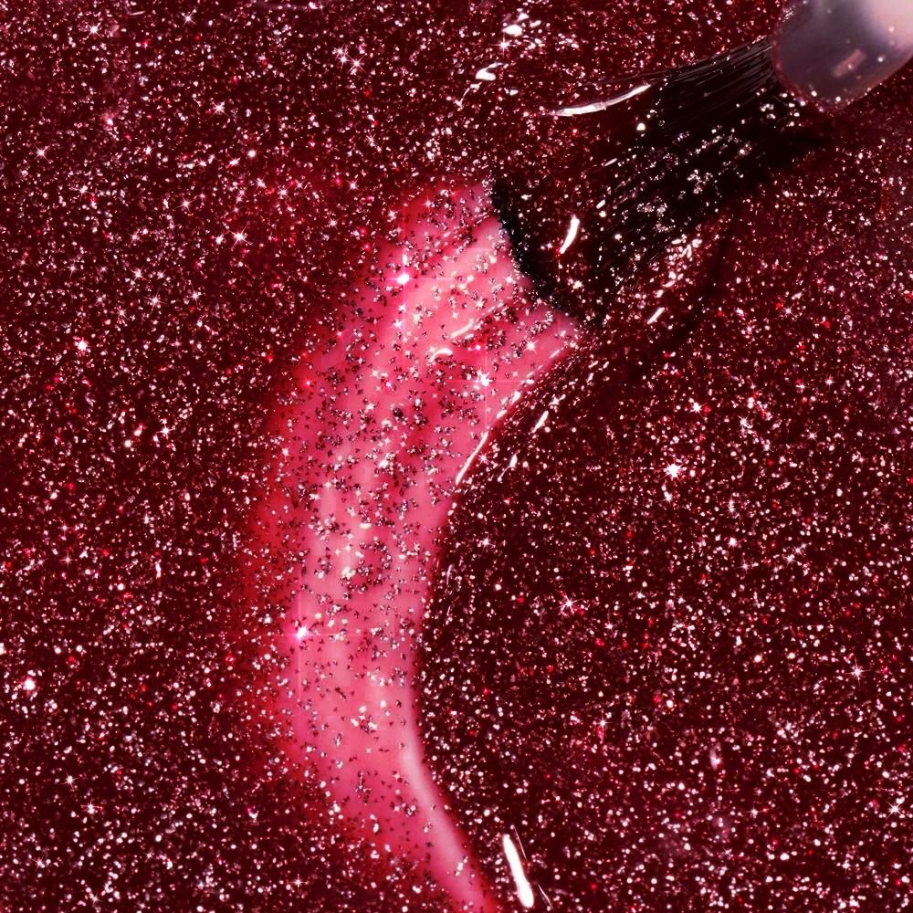 Nahaufnahme von Gellack Effect X Collection Disco Celebrity 8 ml: roter Glitter-Gellack mit feinen Schimmerpartikeln und brillantem Glanz für glamouröse Nägel