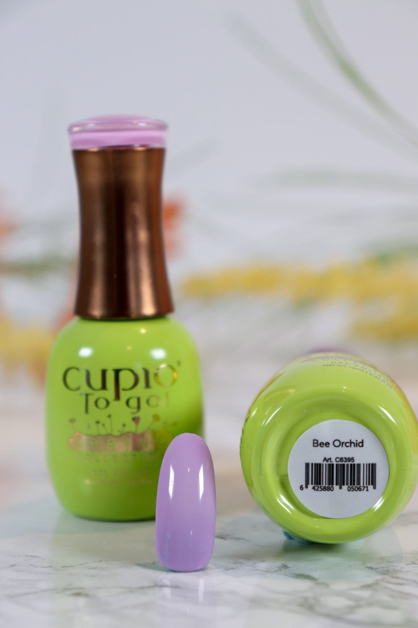 348857169_621016530059444_3006325620772162160_n Flasche von Cupio To Go Nagellack in frischem Grün und lila Testnagel