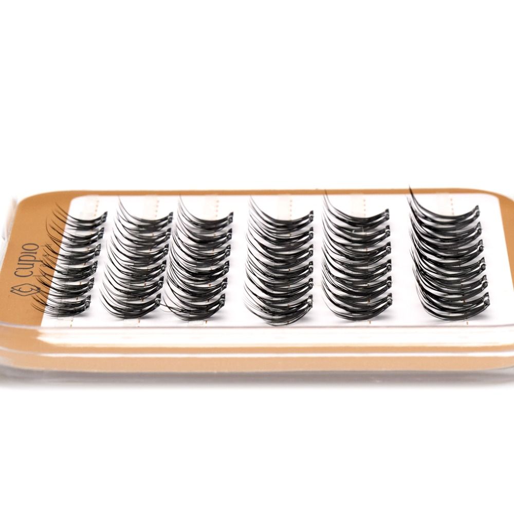 Tray mit Cupio Wimpern-Clustern in Schwarz, gebogene künstliche Einzelwimpern für professionelle Wimpernverlängerung