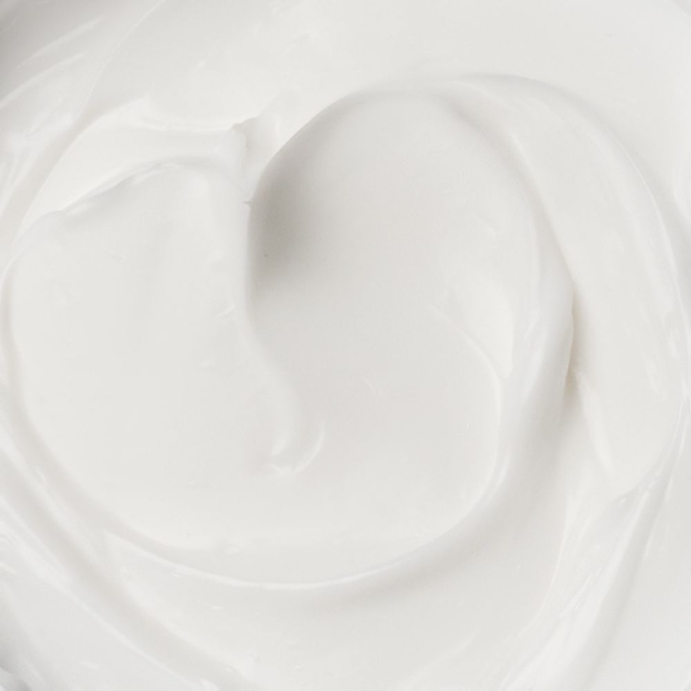 Nahaufnahme einer glatten weißen Creme- oder Lotiontextur