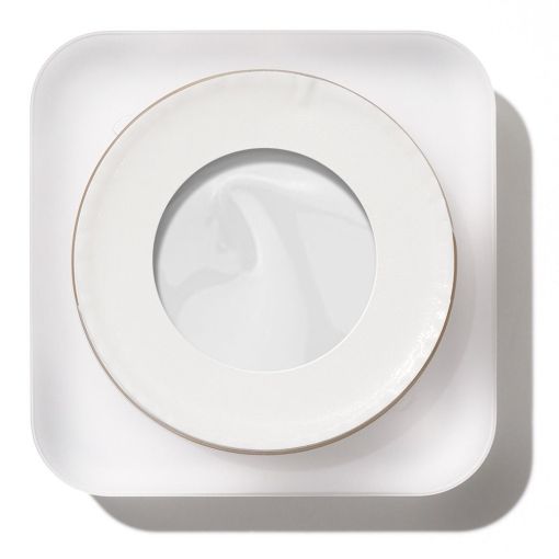 Obere Ansicht einer runden weißen Creme-Dose auf Schale