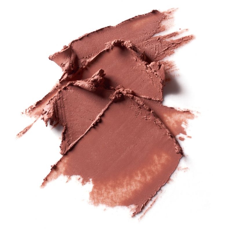 Roséfarbene, cremige Makeup-Textur auf weißem Hintergrund