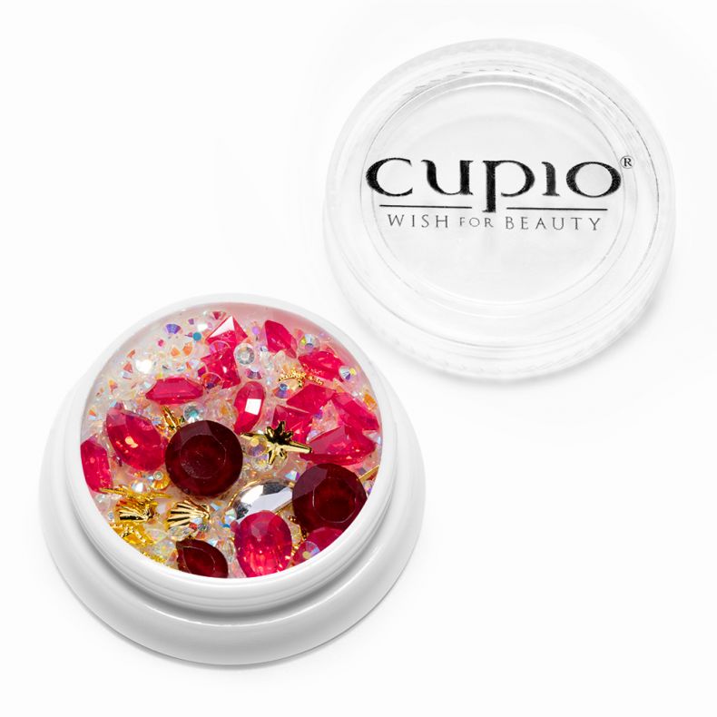 Dose mit roten und bunten Strasssteinen für kreative Nageldesigns