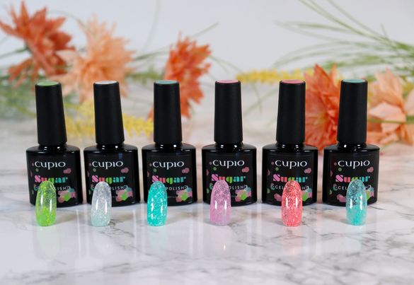 348914067_999829848045457_4832977909838090589_n Cupio Sugar Gellack mit verschiedenen Farbvarianten und Nagelspitzen auf einer Marmortafel
