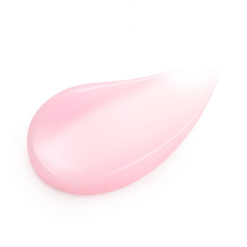 Ein Tropfen rosafarbener Creme oder Lotion auf weißem Hintergrund