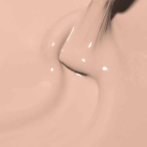 Beige flüssige Makeup-Grundierung wird gegossen