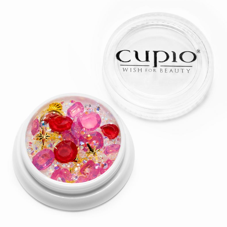 Dekorationssteine in Pink, Rot und Gold in einem transparenten Becher von Cupio