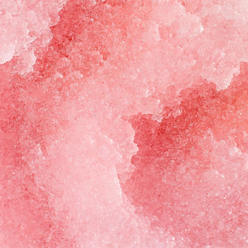 Nahaufnahme rosa Kristalle mit feinkörniger, glitzernder Oberfläche als Produktdetail