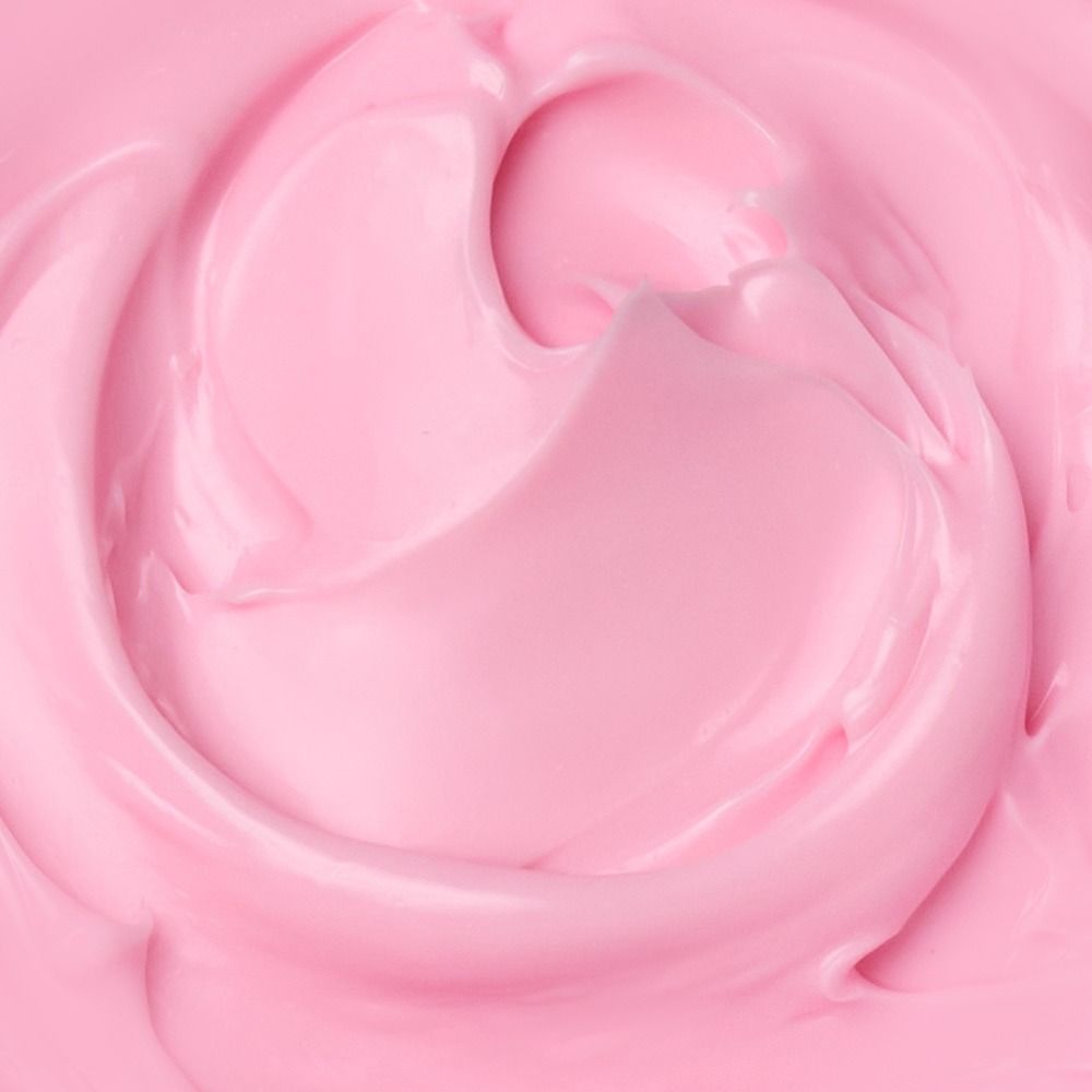 Nahaufnahme einer rosa Gesichtscreme mit weicher Textur