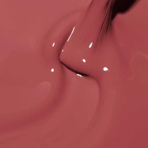 Nahaufnahme cremiger rosafarbener Lippenstift fließt